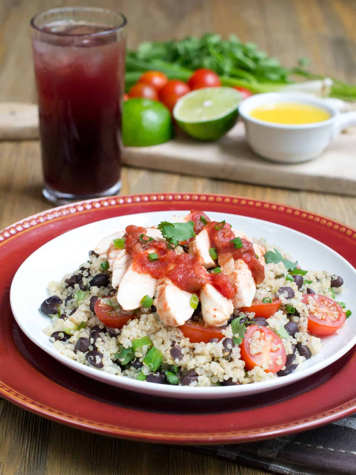 Salsa chicken over black bean quinoa on plate