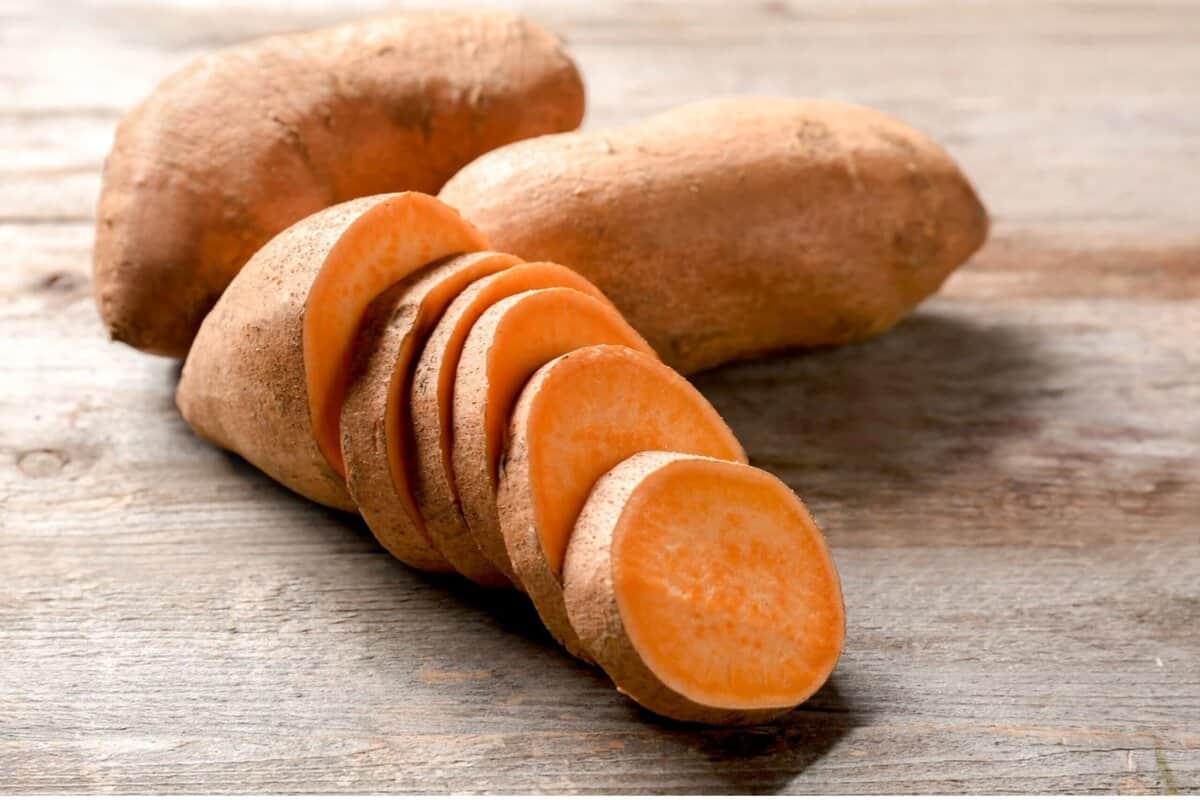 sweetpotatoes sliced on a cutting board