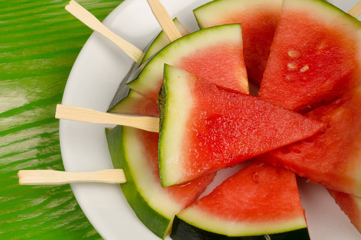 Pomegranate Watermelon Pops on white plate. 