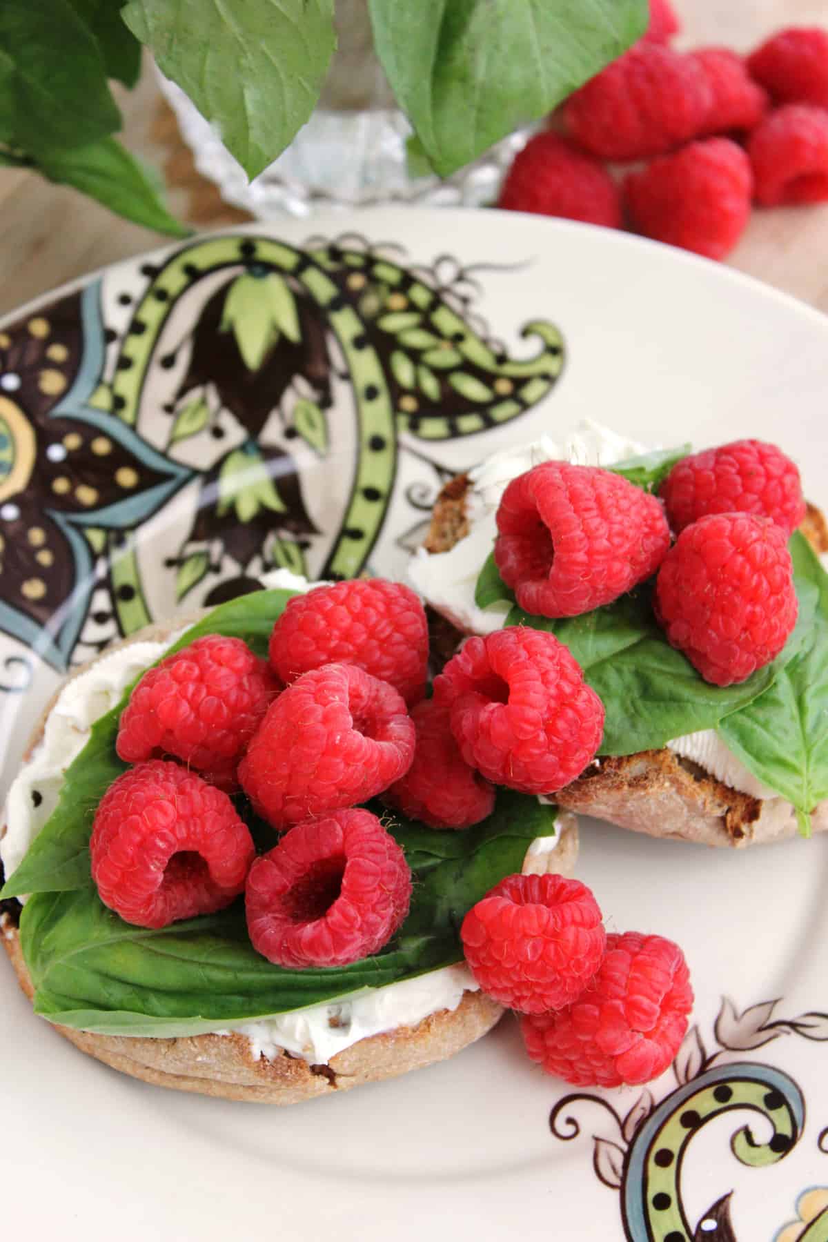 raspberries and basil on whole wheat muffins