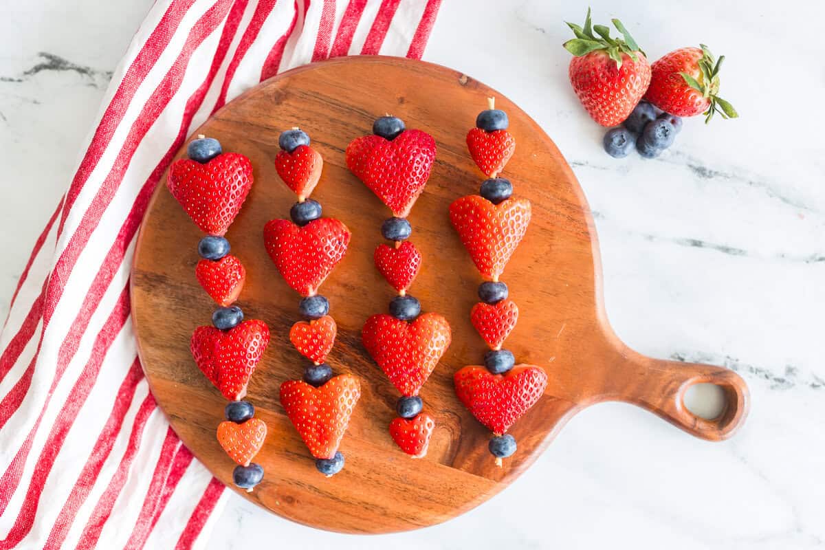 Strawberry Valentine's Day Skewers Strawberry Valentine's Day Skewers on a board.