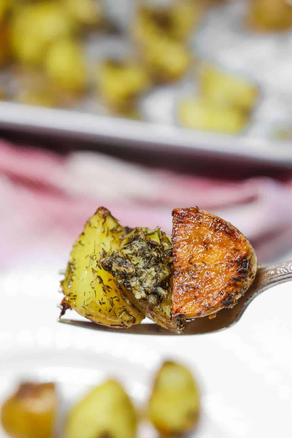 Dill & Garlic Roasted Potatoes on fork