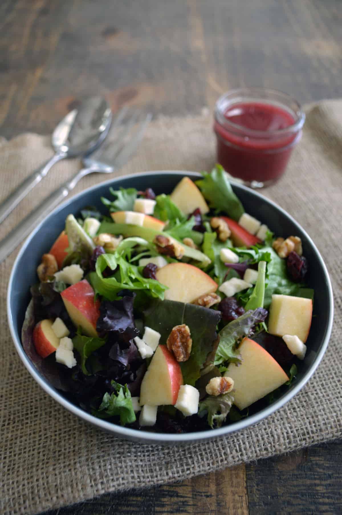 Apple and walnut salad with feta in bowl