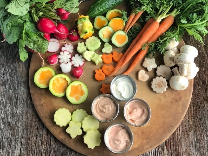 Veggies cut into shapes on cutting board