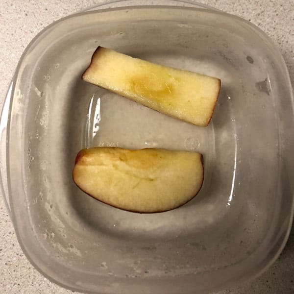 Sliced apples in salt water