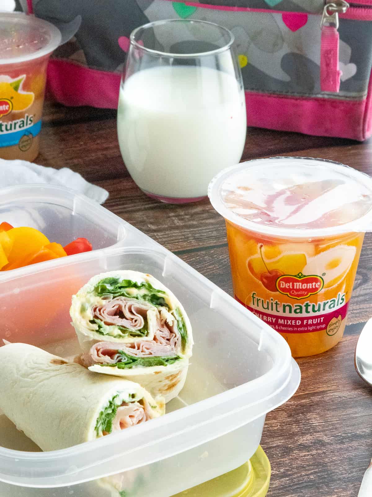 Ham & Spinach Wraps in Lunchbox with fruit cup 