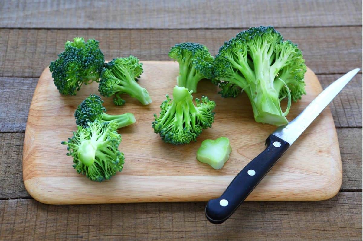 broccoli cut open on cutting board for broccoli rice. 