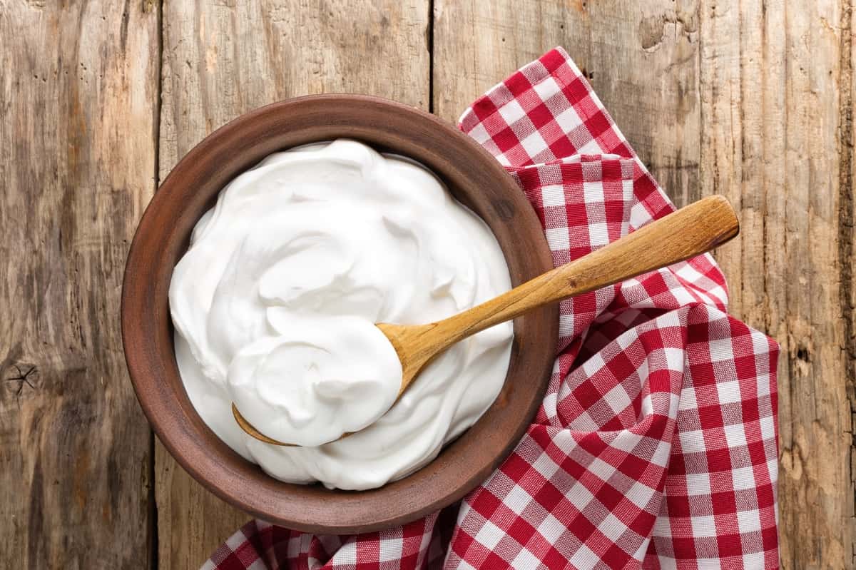 Greek Yogurt for smoothie In bowl with spoon.