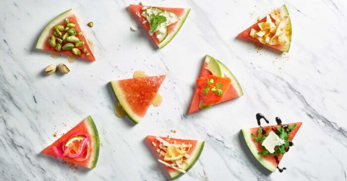 Slices of watermelon on marble background.