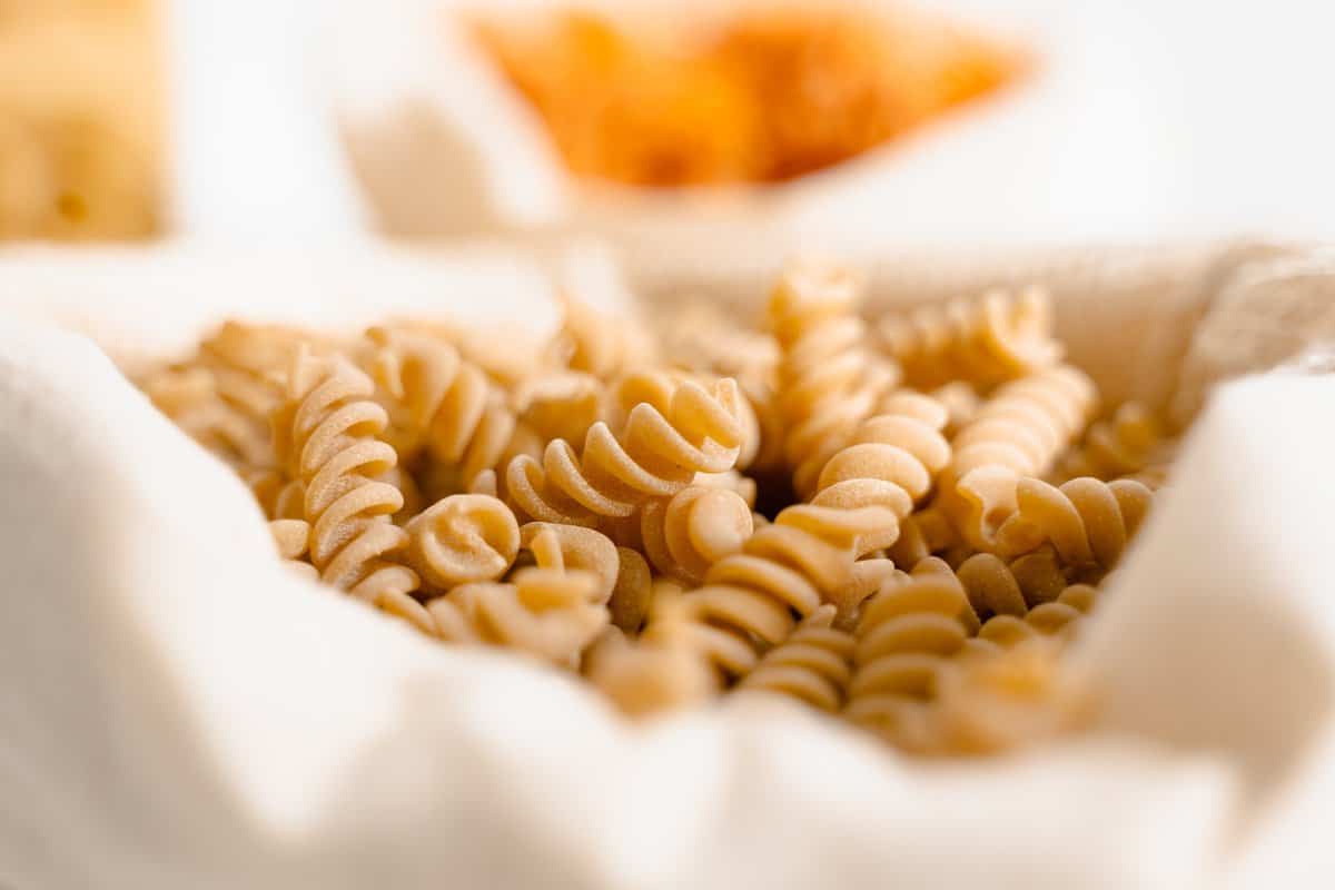 Quick and Easy Tuna Pasta Salad Raw Fusilli on White Textile