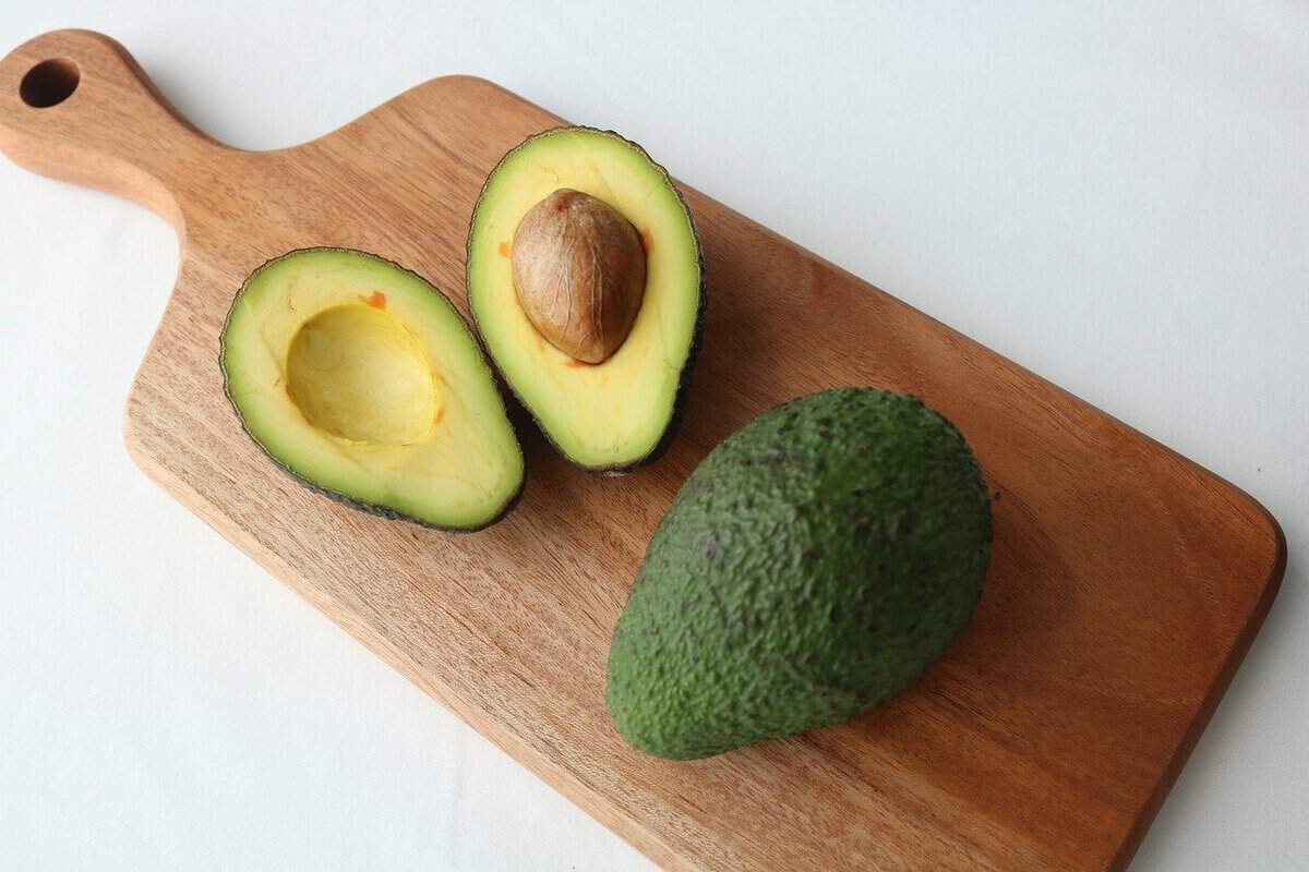 avocado sliced open for avocado slaw 