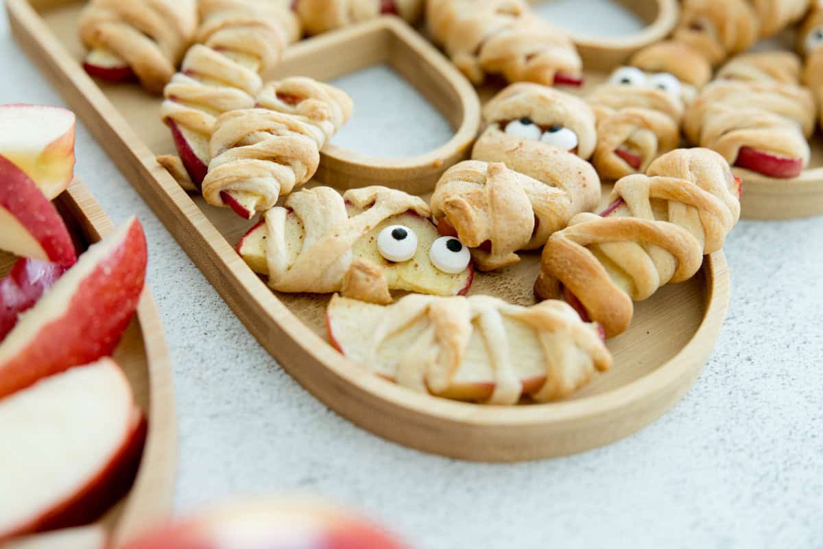 Healthy Halloween Mummy Apples snack with funny eyeballs.