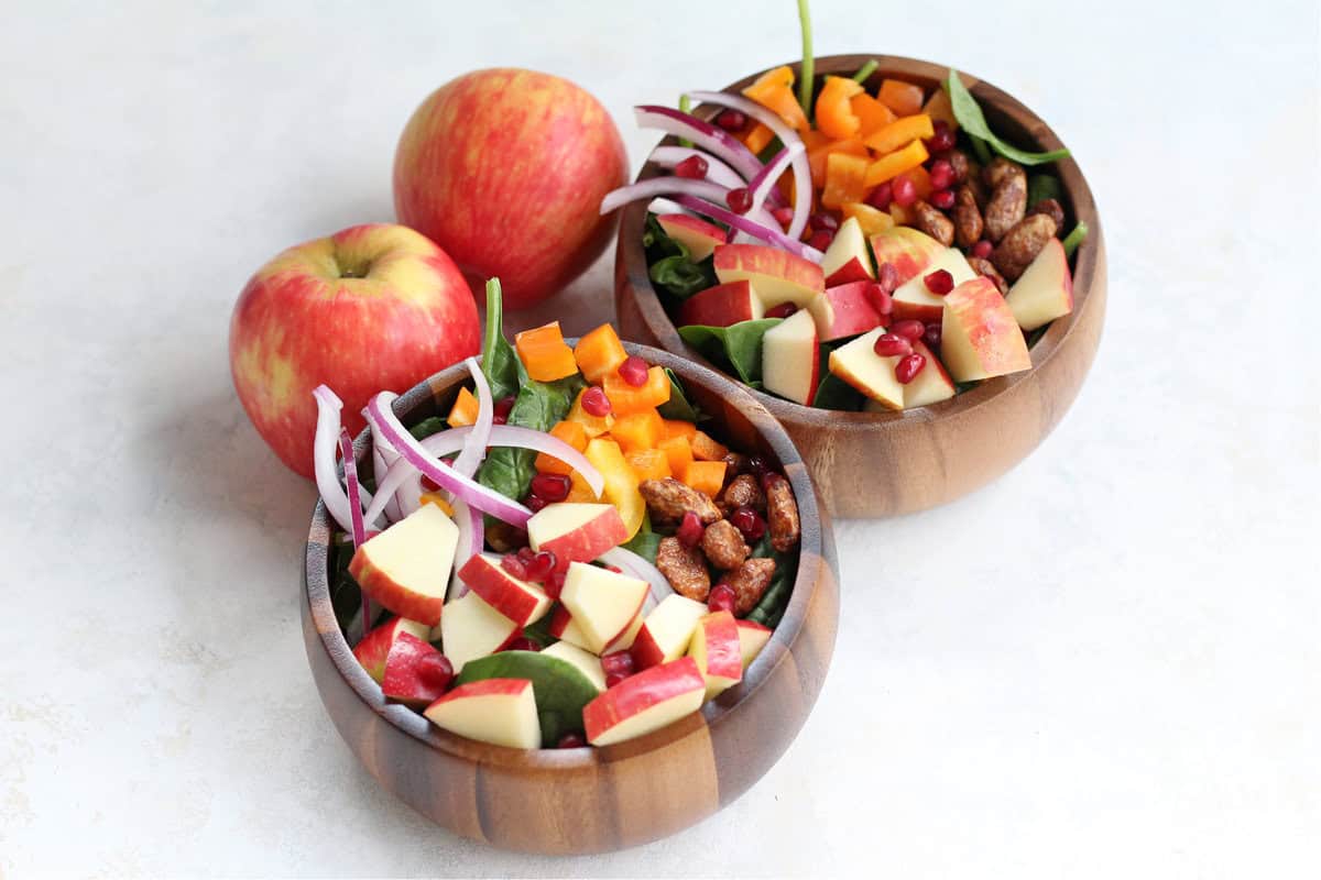 Tasty Apple Spinach Harvest bowls and two Honeycrisp apples.