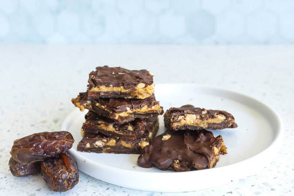 Delicious date bar with peanuts and covered with dark chocolate