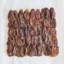 Dates spread on baking sheet