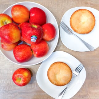 Mini Apple Pies made and Kanzi Apples on a ceramic bowl