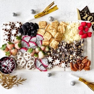 Sweet snack board with New Year's decorations.