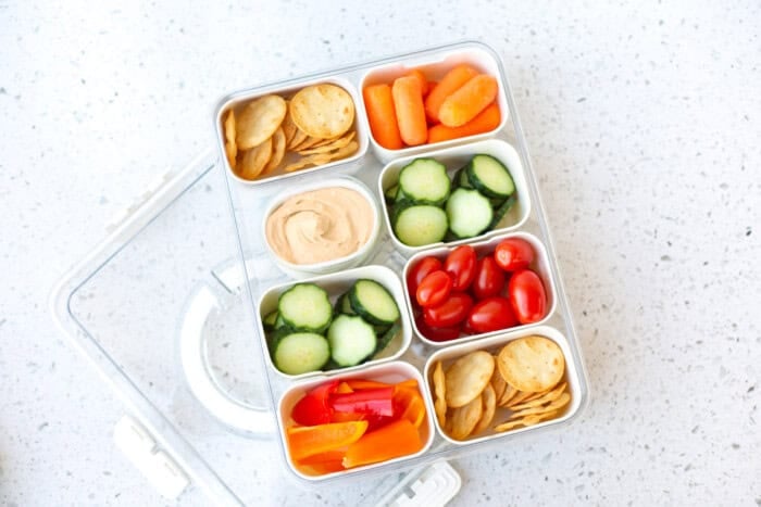 Excellent snack box with vegetables and hummus. A perfect snack choice.
