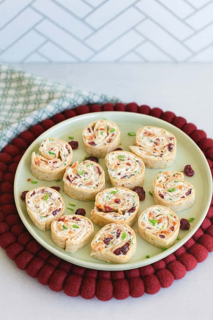 turkey bacon cranberry pinwheels made with whole grain tortillas, cream cheese, dried cranberries and green onions.