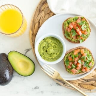 Easy avocado breakfast ideas with guacamole English muffins topped with tomato and cilantro