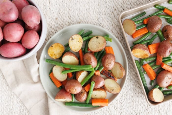 Roasted baby potatoes with green beans and carrots served as an easy vegetable side dish