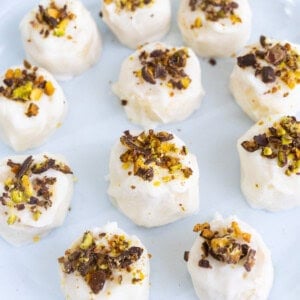 Chocolate Pistachio Frozen Banana Bites topped with Greek yogurt and chopped Wonderful Chocolate Pistachios